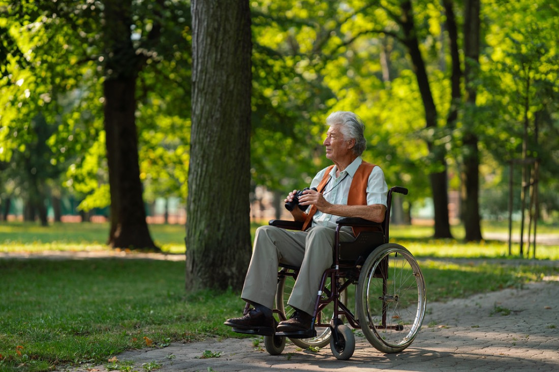 Senior enjoying the outdoors in a wheelchair